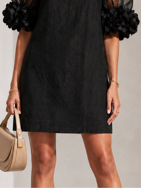 Aurea | Minidress in Organza Nera con Maniche Voluminose e Polsini a Fiore Imponenti