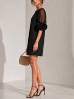 Aurea | Minidress in Organza Nera con Maniche Voluminose e Polsini a Fiore Imponenti
