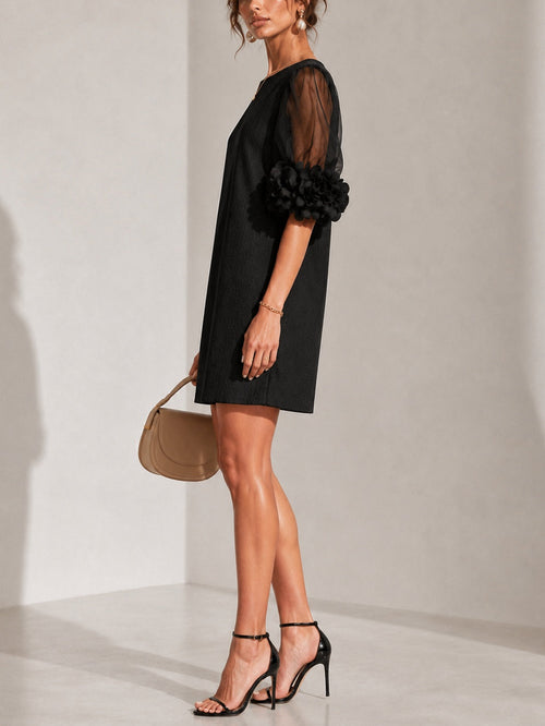 Aurea | Minidress in Organza Nera con Maniche Voluminose e Polsini a Fiore Imponenti